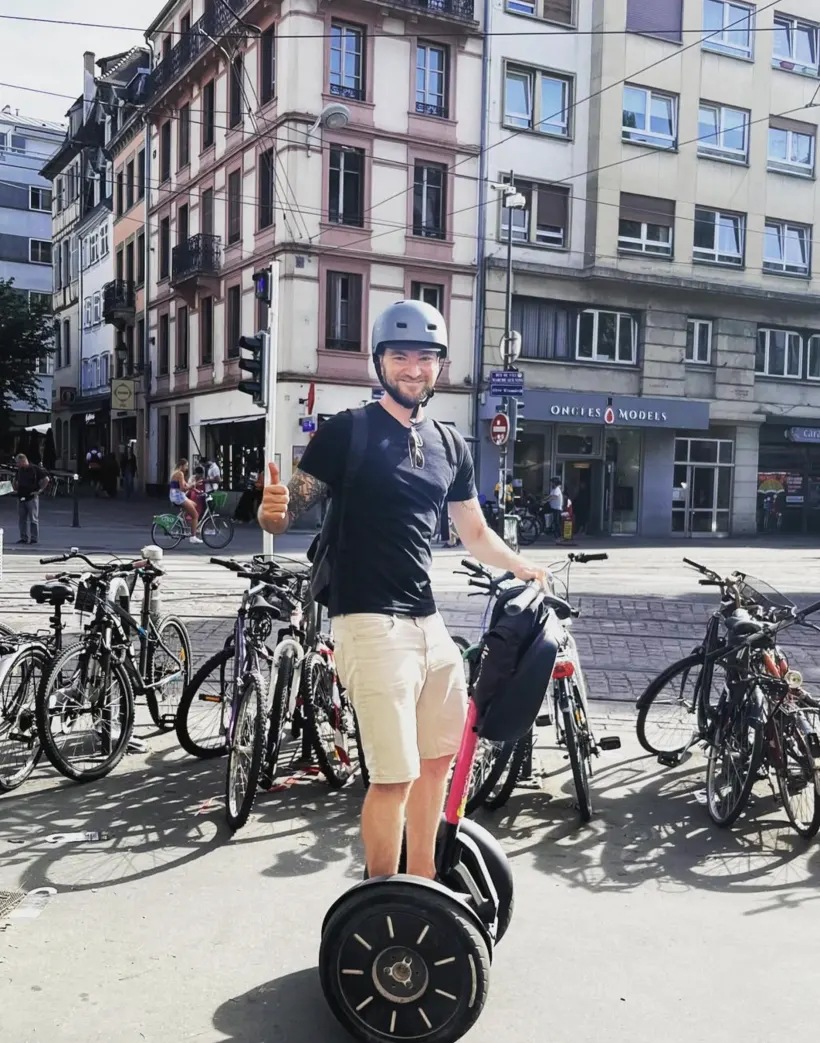 Michael on a segway tour in a city square