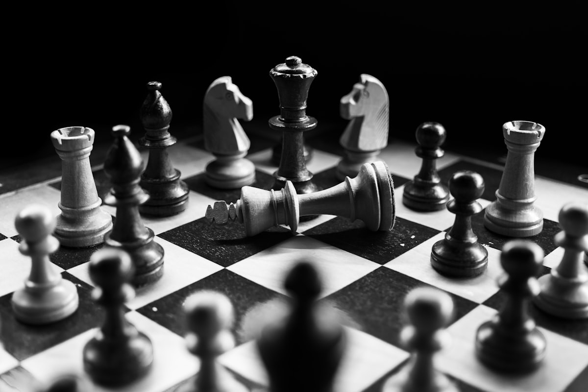 Chess pieces mid-game, representing strategic positioning
