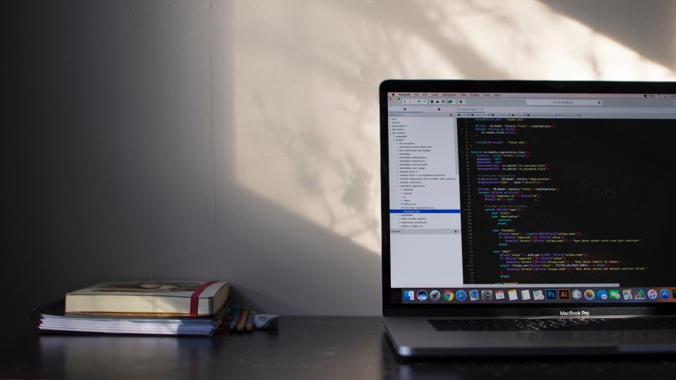A developer coding on a dark screen