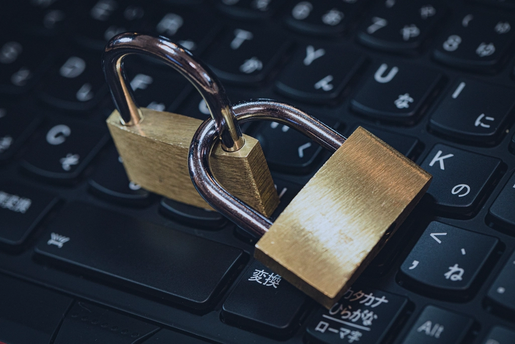 A padlock resting on a laptop