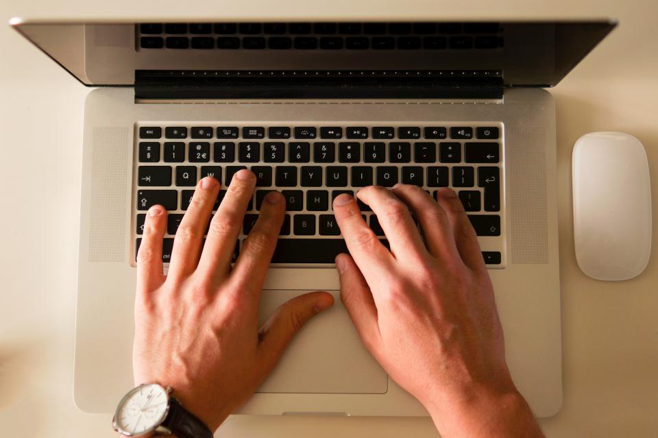 A hand on a computer mouse