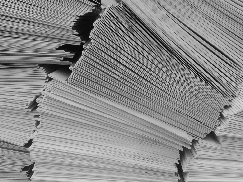 Stacked documents on a desk