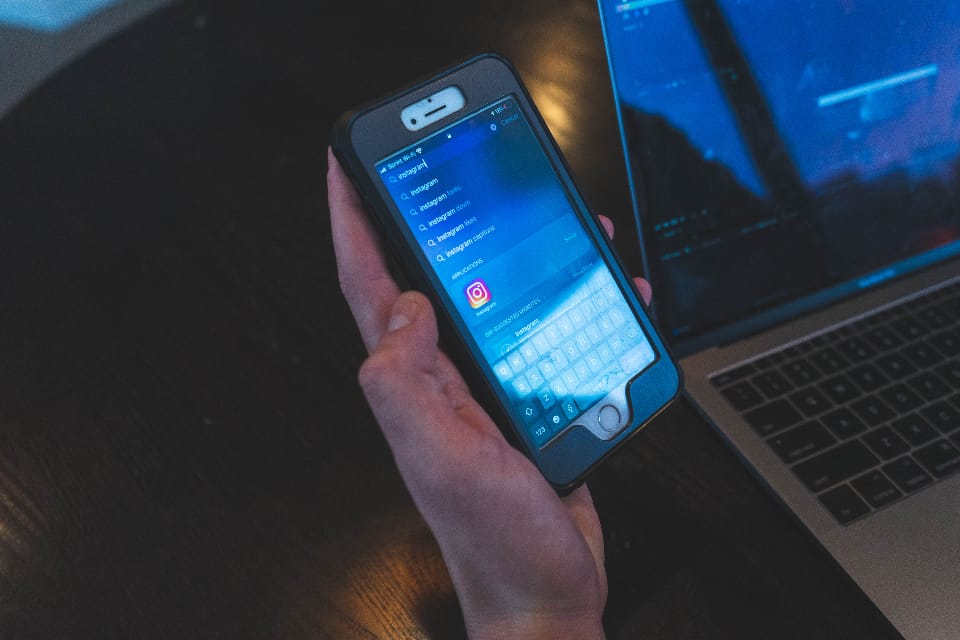 A hand holding a smartphone