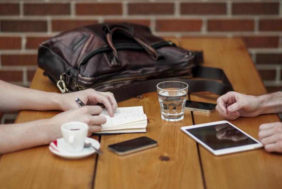 A tablet and phone on a table