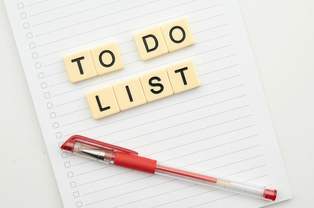 A handwritten to-do list in a notebook